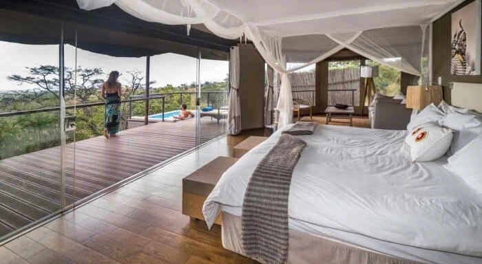 Luxury lodge with curved thatched roof in the wilderness
